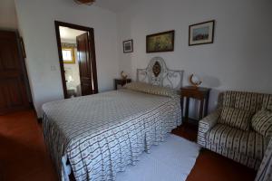 A bed or beds in a room at Quinta Da Aldeia