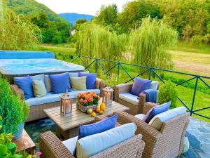 a patio with couches and a hot tub at Casa Jana Croatia in Jastrebarsko