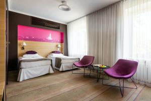Posteľ alebo postele v izbe v ubytovaní Hotel Cristal Białystok