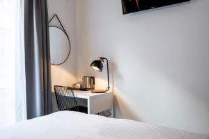 Postel nebo postele na pokoji v ubytování Beverly Hills Hotel