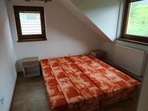 Posteľ alebo postele v izbe v ubytovaní Apartmány Švec