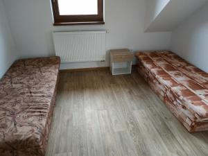 Postel nebo postele na pokoji v ubytování Apartmány Švec