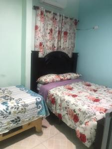 Postel nebo postele na pokoji v ubytování Hotel Gazcue