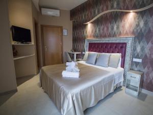 Postel nebo postele na pokoji v ubytování Hotel Lady Mary