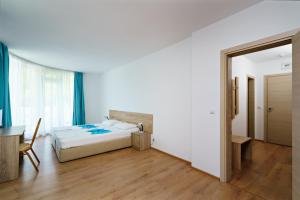 Postel nebo postele na pokoji v ubytování Hotel Elitza