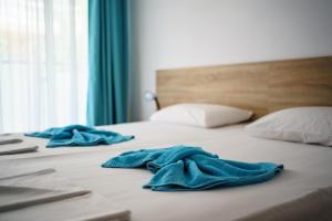 Postel nebo postele na pokoji v ubytování Hotel Elitza