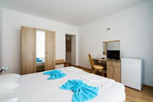 Postel nebo postele na pokoji v ubytování Hotel Elitza