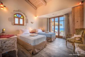 Postel nebo postele na pokoji v ubytování Blue Caves Villas - exceptional Villas with private pools direct access to the sea