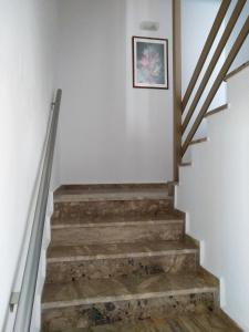 a staircase leading up to a stair case at Calypso in Agia Roumeli