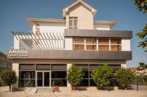 a building in front of a building at Ambra Resort Hotel All inclusive in Anapa