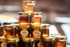 a pile of jars of honey on a table at Crowne Plaza Athens City Centre, an IHG Hotel in Athens