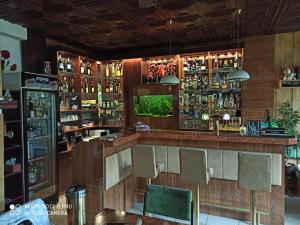 a bar in a restaurant with chairs and a counter at Penzion U Bernardýna in Tachov