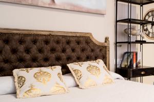 En eller flere senge i et værelse på Suite Capitán 3