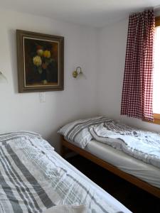 Voodi või voodid majutusasutuse Chalet Valaisia toas
