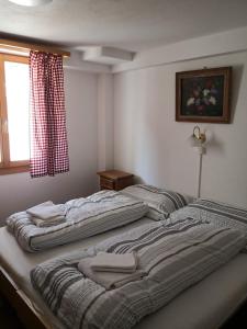 Voodi või voodid majutusasutuse Chalet Valaisia toas