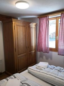 Voodi või voodid majutusasutuse Chalet Valaisia toas