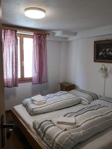 Voodi või voodid majutusasutuse Chalet Valaisia toas