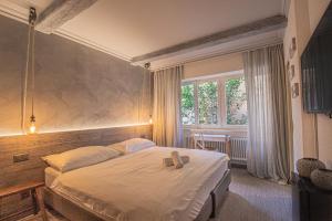 Letto o letti in una camera di Seven Boutique Hotel