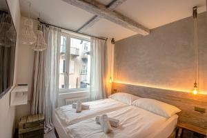 Letto o letti in una camera di Seven Boutique Hotel