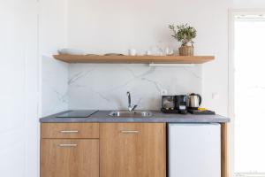 A cozinha ou cozinha compacta de Sea Wind Villas and Suites