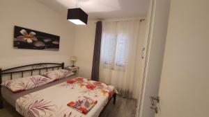 Postel nebo postele na pokoji v ubytování Apartments with sea view