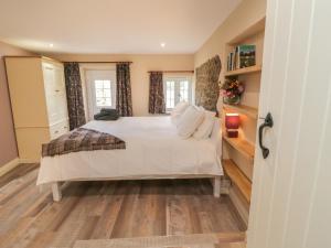 Krevet ili kreveti u jedinici u objektu Langham House Cottage