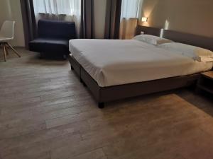 Posteľ alebo postele v izbe v ubytovaní Hotel & Wellness Stella Delle Langhe