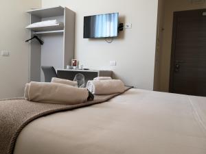 Posteľ alebo postele v izbe v ubytovaní Hotel & Wellness Stella Delle Langhe