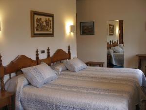 Postel nebo postele na pokoji v ubytování Hotel Siglo XVIII