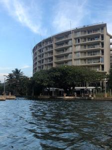 a large building next to a body of water at The Sails in Durban