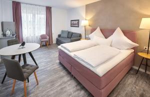 Кровать или кровати в номере Excellentas Apartments Hannover