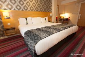 Voodi või voodid majutusasutuse Holiday Inn Newcastle-Jesmond, an IHG Hotel toas