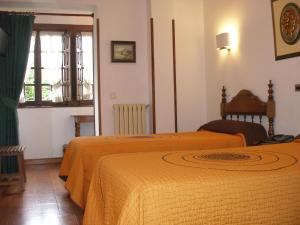 Postel nebo postele na pokoji v ubytování Hotel Siglo XVIII