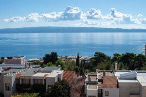 a view of the water from the roofs of buildings at Trstenik Beach Apartment in Split