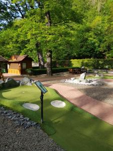 a miniature golf course with a putting green at Ferienwohnung Reese- Horstmann mit Hallenbad und Sauna, WLAN "Harz zu jeder Jahreszeit" in Bad Harzburg