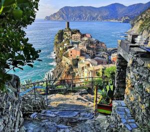 a village on a hill next to the ocean at Sea & Culture - 5 Terre La Spezia in La Spezia
