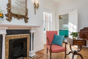 a living room filled with furniture and a fire place at 20 South Battery in Charleston