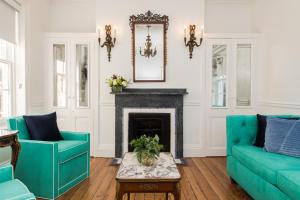 a living room filled with furniture and a fireplace at 20 South Battery in Charleston