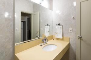 a bathroom with a sink and a mirror at Estilo em Copacabana - Próximo a praia - BR403 Z4 in Rio de Janeiro +41 photos