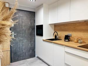 Kuchyňa alebo kuchynka v ubytovaní LM Ventus Apartment