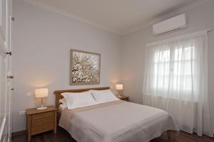 Postel nebo postele na pokoji v ubytování Villa Corfu Melody