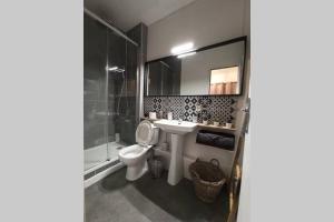 a bathroom with a toilet and a sink and a shower at Un petit paradis pour se détendre et se ressourcer in Montrichard +23 photos