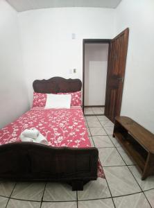 Postel nebo postele na pokoji v ubytování Casa Thayla Pousada