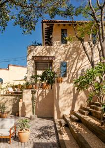 a house with a staircase leading up to it at Hotel Casa Santo Origen in Oaxaca City