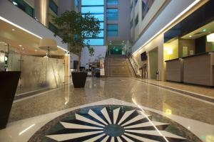 a hallway of a building with a staircase in it at Holiday Inn Mexico City - Trade Center by IHG in Mexico City