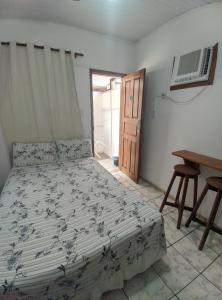 Postel nebo postele na pokoji v ubytování Casa Thayla Pousada