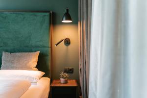 Letto o letti in una camera di Floris Green Suites by Parc Hotel Florian