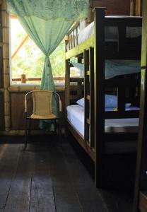 En eller flere senger på et rom på La Natura Hostel & Pool