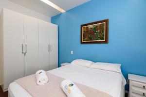 Excelente em Ipanema - Ambiente familiar - BT101 Z2 tesisinde bir odada yatak veya yataklar