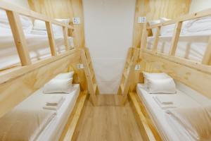 Ein Bett oder Betten in einem Zimmer der Unterkunft Step Inn Myeongdong 1